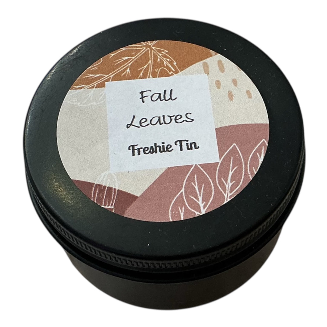Round black Freshie Tin car air freshener and odor eliminator, available in multiple sizes.