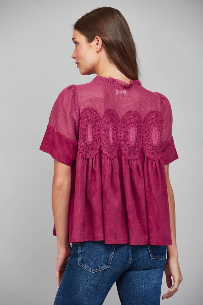 Teal blue short-sleeved top, size L, featuring a sheer mesh upper back panel with oval lace appliqué and a faux suede lower section.