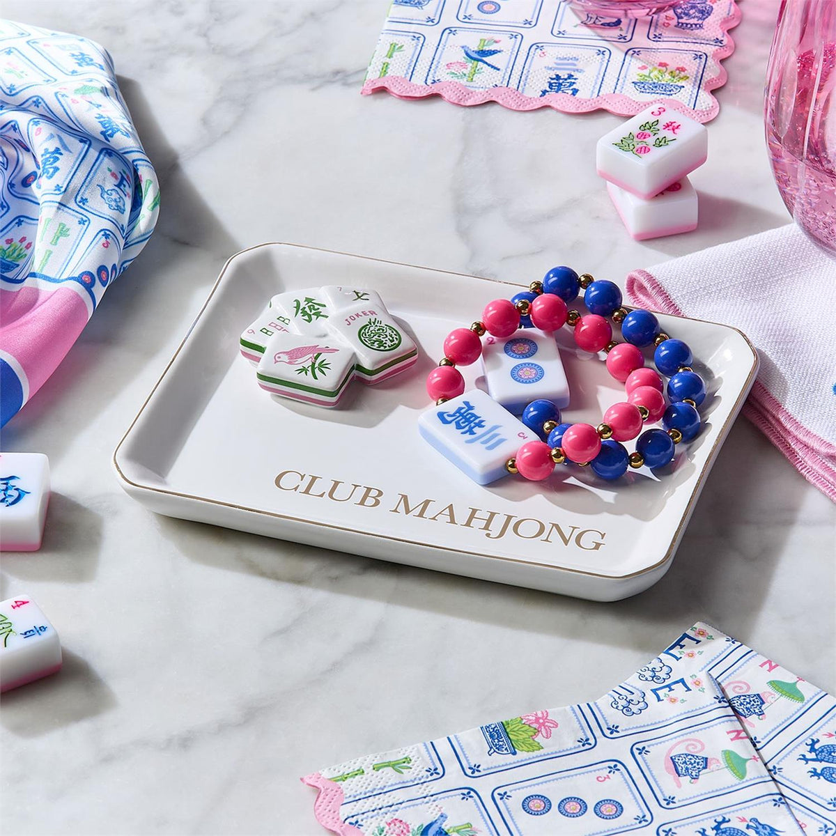 Mahjong Beaded Stretch Bracelet, vibrant and colorful, displayed in a tray labeled “CLUB MAHJONG.” Sizes available: stretch to fit most wrists.