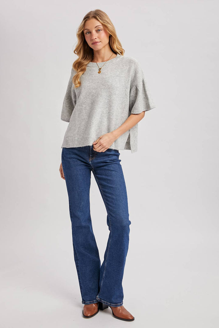 Light gray boxy knit sweater top with gathered short sleeves and side slits, size M/L.