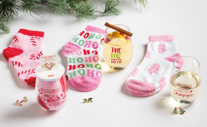 Holiday Wine Glass, Earring, &amp; Sock Set including two holiday tree wine cups, three pairs of patterned fuzzy socks, and three pairs of holiday-themed stud earrings.
