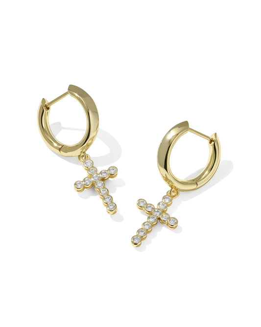 Gold huggie earrings with dangling cross charms, detailed with small clear crystals. Available in S, M, and L sizes.