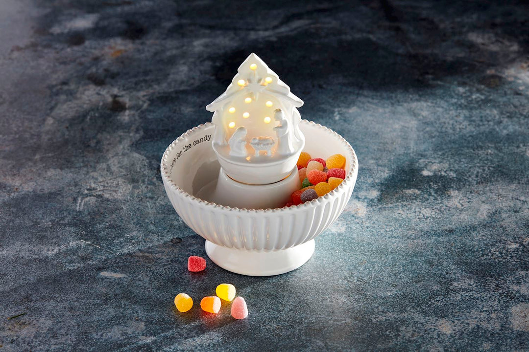 White ceramic Light-Up Nativity Sitter bowl with LED centerpiece and “here for the candy” text.