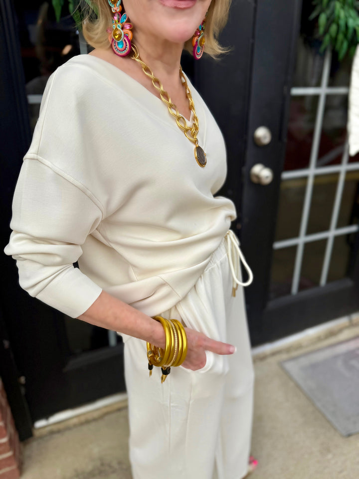 Hazel Ivory Top, a cream-colored blouse made from lightweight CloudSilk™ modal blend. Available in sizes XS-XL.