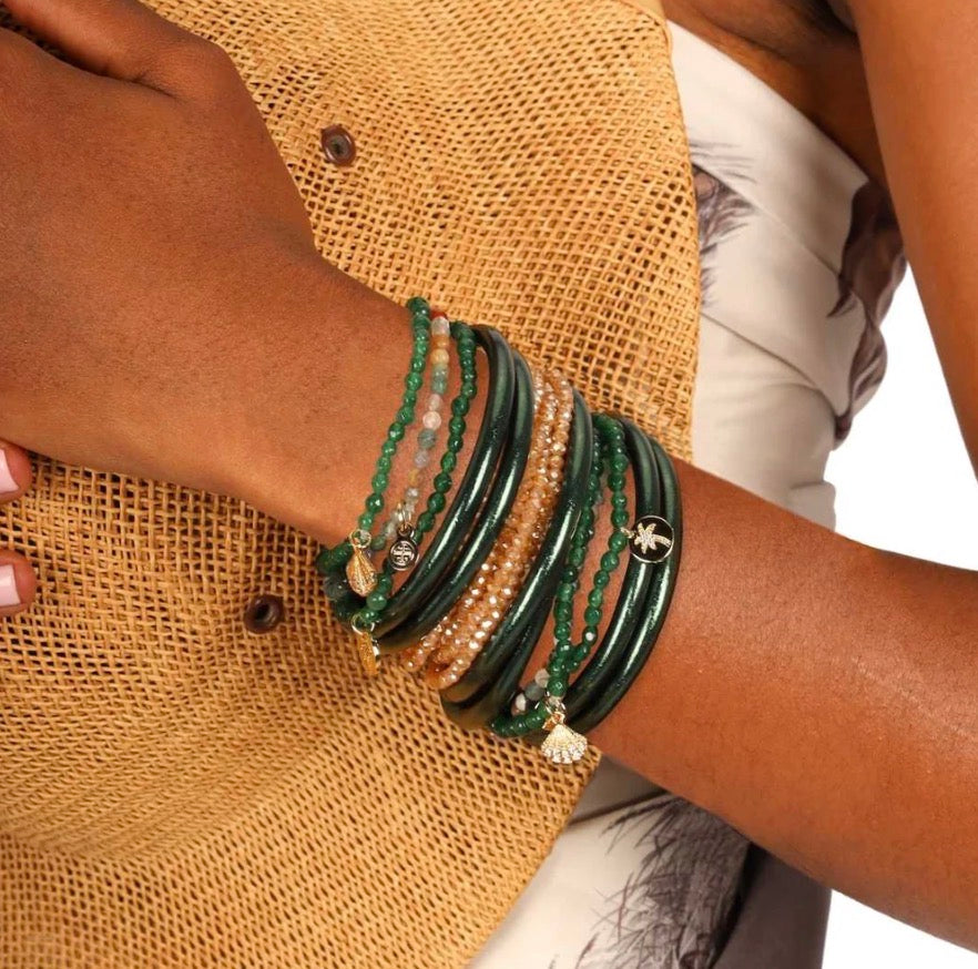 Green and gold Frond All Weather Bangles shown; available in sizes S, M, L.