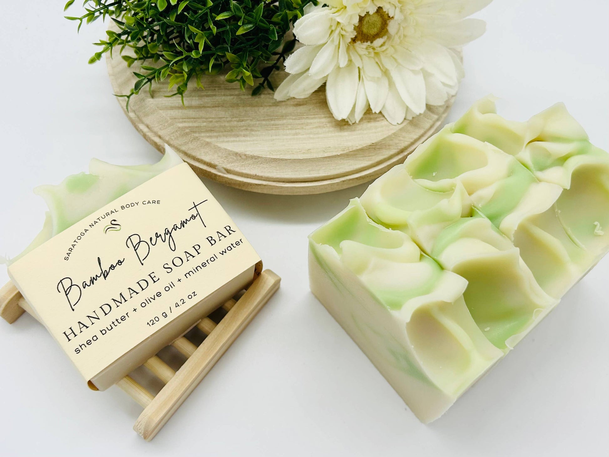 slight marbling effect. Vegan and cold process soaps crafted from natural ingredients, scented with refreshing bamboo and bergamot. Each bar measures approximately 3” x 2” x1”. Suitable for all skin types, gentle formula that cleanses without drying out skin. Comes in a pack of two bars.