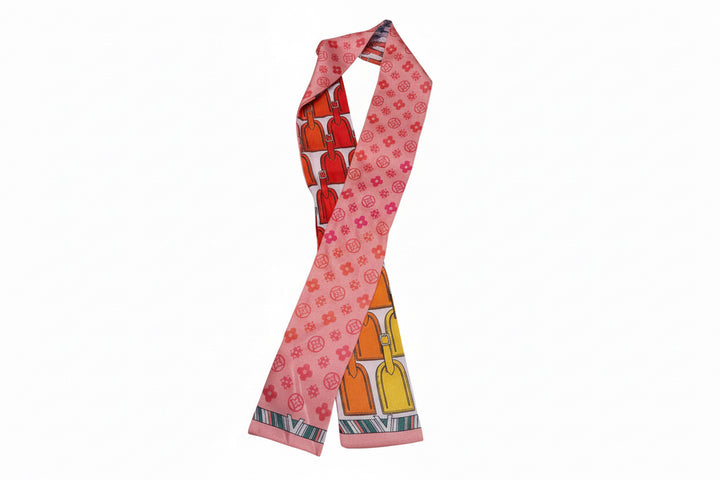Pink silk Twilly Scarf with orange, yellow, red locks and small circles. Available sizes: 32"x2".