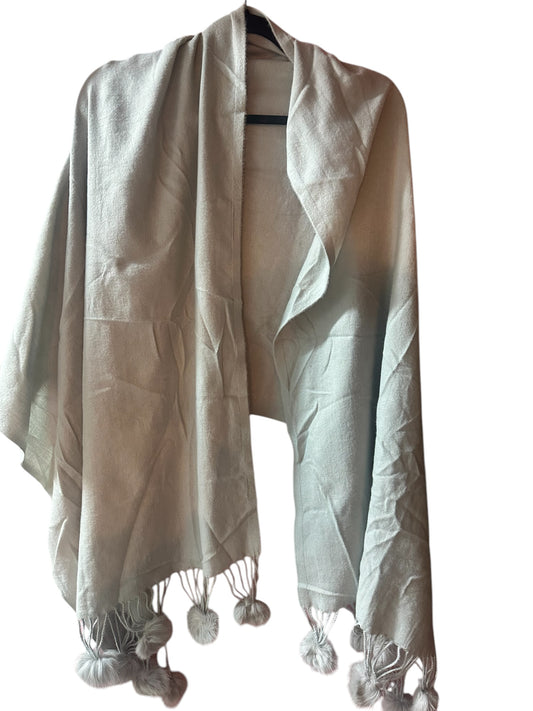 Light beige shawl with textured fabric and faux fur tassels on edges. Available sizes: S, M, L, XL.