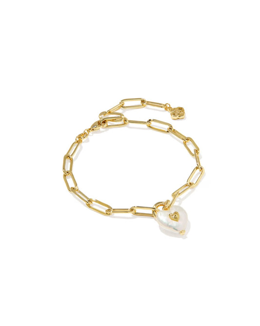 Gold paperclip chain bracelet with elongated links, heart-shaped pearl charm, and small gold accent by clasp. Sizes available.