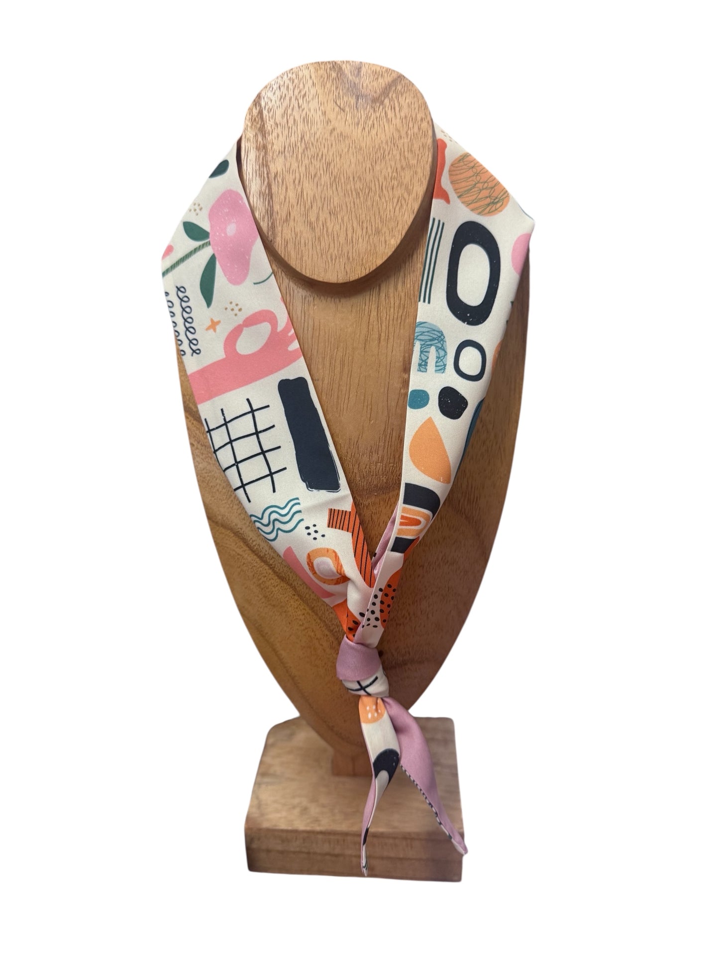 Scarf Necklace with abstract pink, black, orange, and teal shapes; available in small and large sizes; multi-functional accessory.