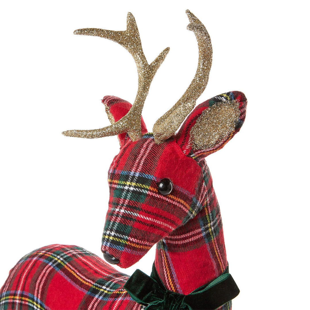 Tartan red fabric reindeer figurine with glittery gold antlers and a green velvet bow.