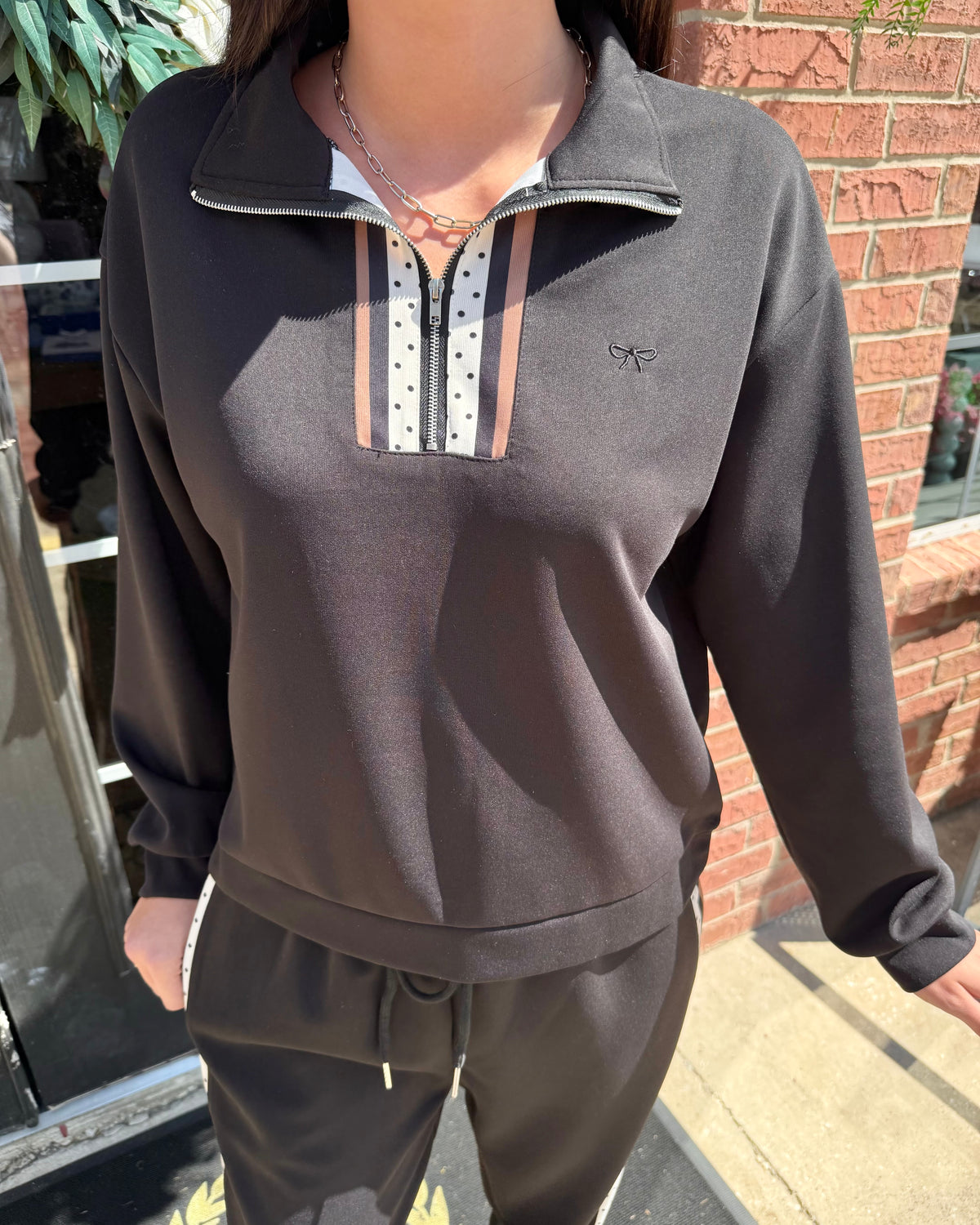 Margot Polka Dot Striped Quarter Zip shown; available in sizes XS-XL.