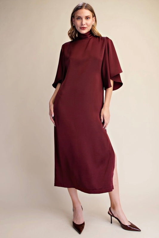 Satin Tie Back Midi Dress in burgundy, knee-length with elbow-length sleeves and high neckline. Available in sizes XS-XL.