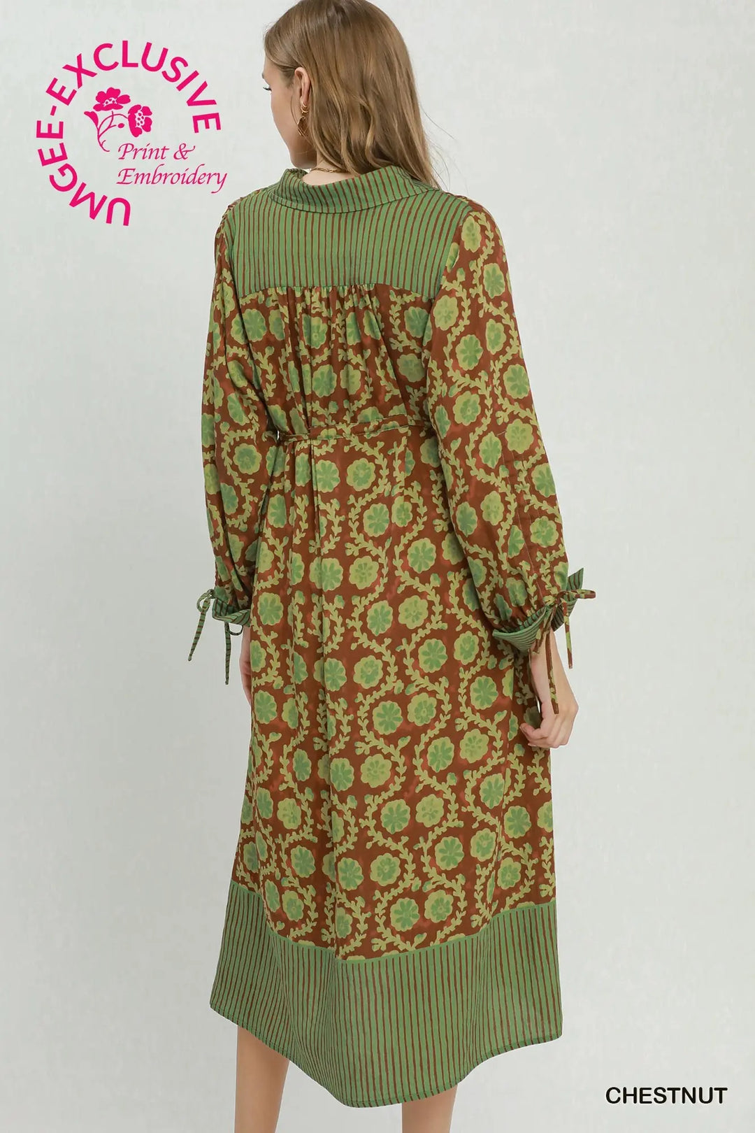 Brown mixed media floral print midi dress featuring a collared neckline, green striped panels on the shoulders and hem, and an adjustable tie waist with tie cuffs.