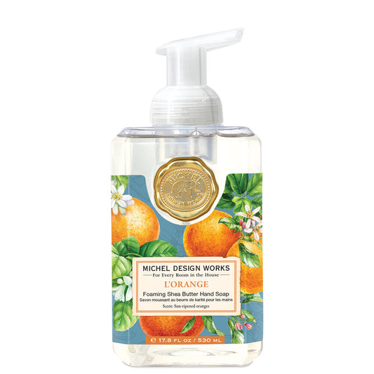 L’Orange Foaming Soap, shea butter, pump dispenser, orange soap. Sizes: 17.8 oz, 2.1 oz. Label with oranges and flowers.