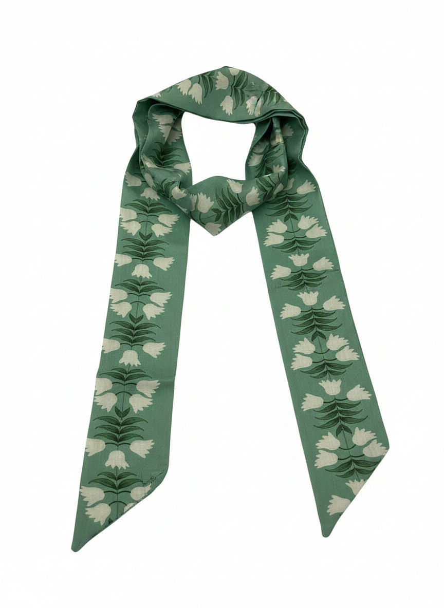 Long green Scarf Necklace with white tulip-like flower pattern; available in multiple sizes.