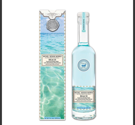 Foaming Bubble Bath Beach: clear bottle with light blue bath, ocean design box, marine scent. Available in 250ml and 500ml.