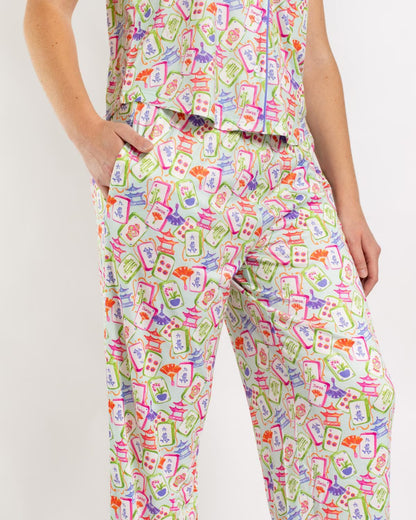 Mahjong Dreams Short Sleeve features a vibrant, colorful Mahjong tile pattern. Available in sizes S–XXL.