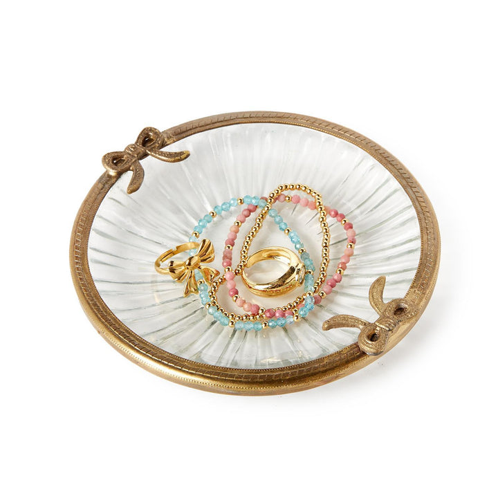 Antique gold finish round glass trinket tray with gold rim and bow accents. Sizes available: small, medium, large.