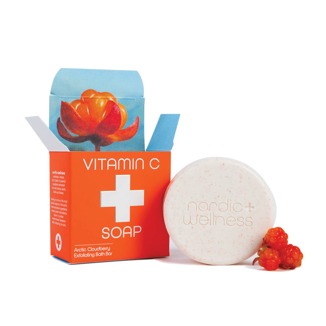 Round white Nordic+Wellness™ Vitamin C Soap bar with orange box, Arctic blend. Available in 100g and 150g sizes.