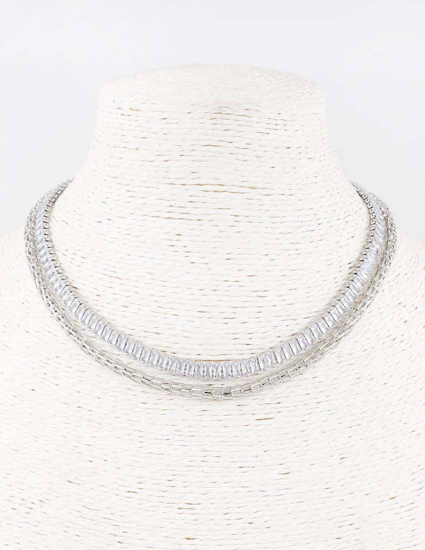 The Cali Silver Necklace by Meghan Browne Style has closely set rectangular clear stones. Available in 16", 18", and 20" lengths.