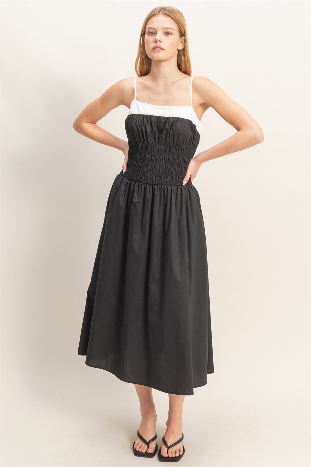 Black Smocked Strapped Midi Dress with white straps, smocked bodice, midi length. Available in sizes XS-XL.