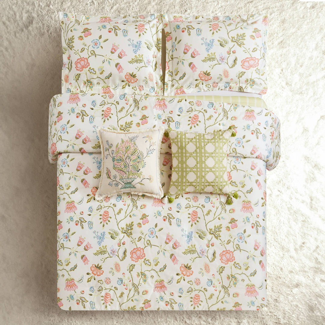 White bedding with a vibrant floral print, available in twin, queen, and king sizes.