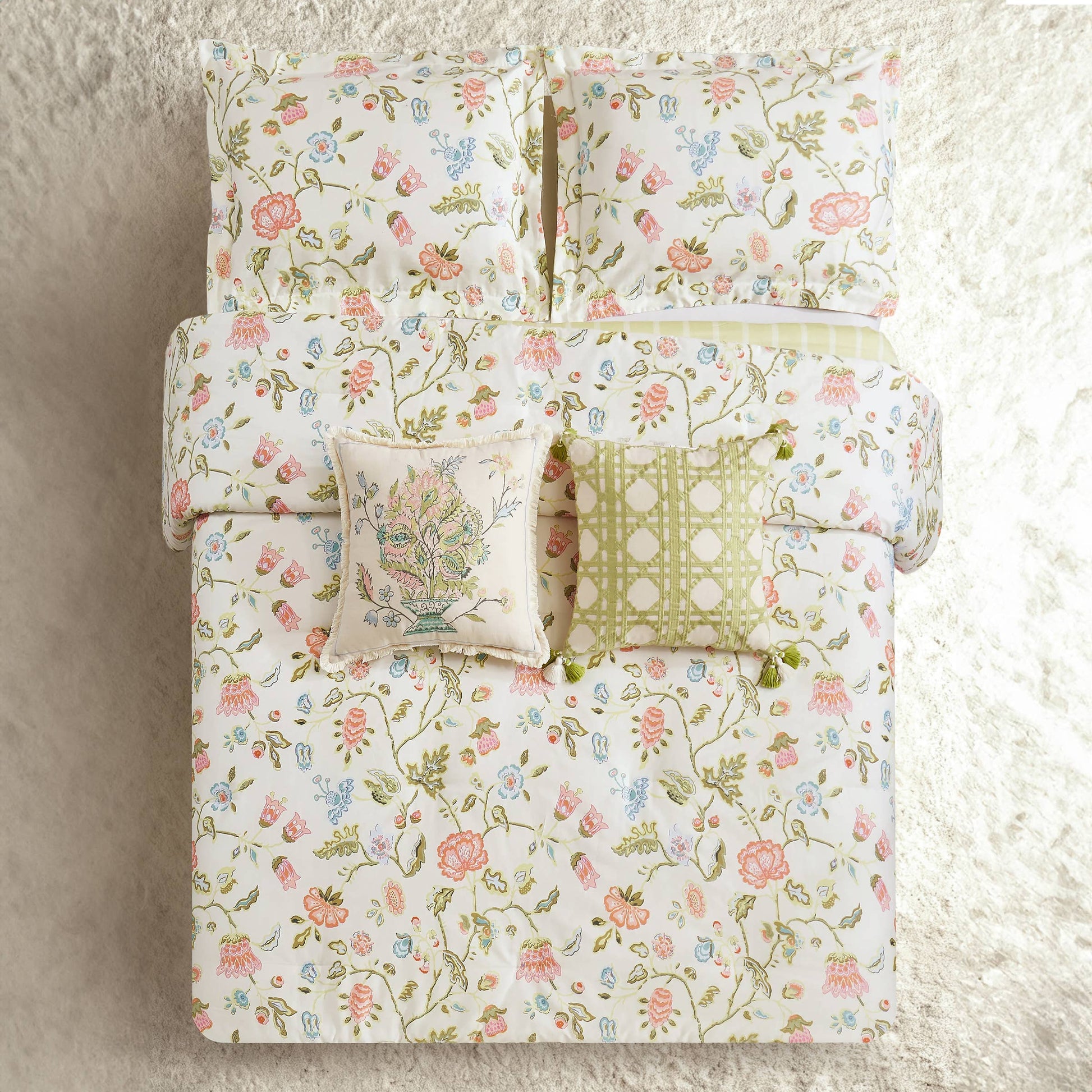 White bedding with a vibrant floral print, available in twin, queen, and king sizes.