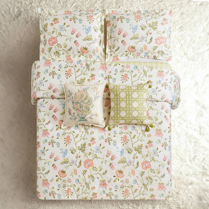 White bedding with a vibrant floral print, available in twin, queen, and king sizes.