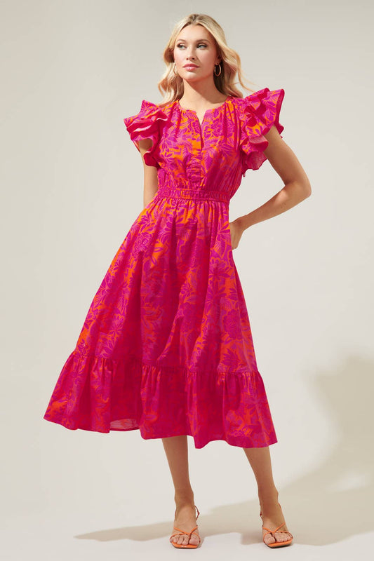 The Bali Tropics Jelina Ruffle Sleeve Midi Dress is a bright pink and purple floral dress featuring ruffle detailing on the sleeves and a ruffle tier skirt.