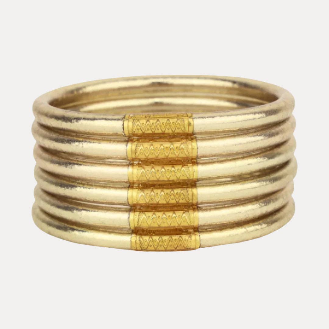 Set of 6 luxury soft gold bangles with textured patterns, stackable. Available in small, medium, and large sizes.