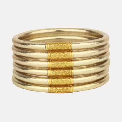 Set of 6 luxury soft gold bangles with textured patterns, stackable. Available in small, medium, and large sizes.