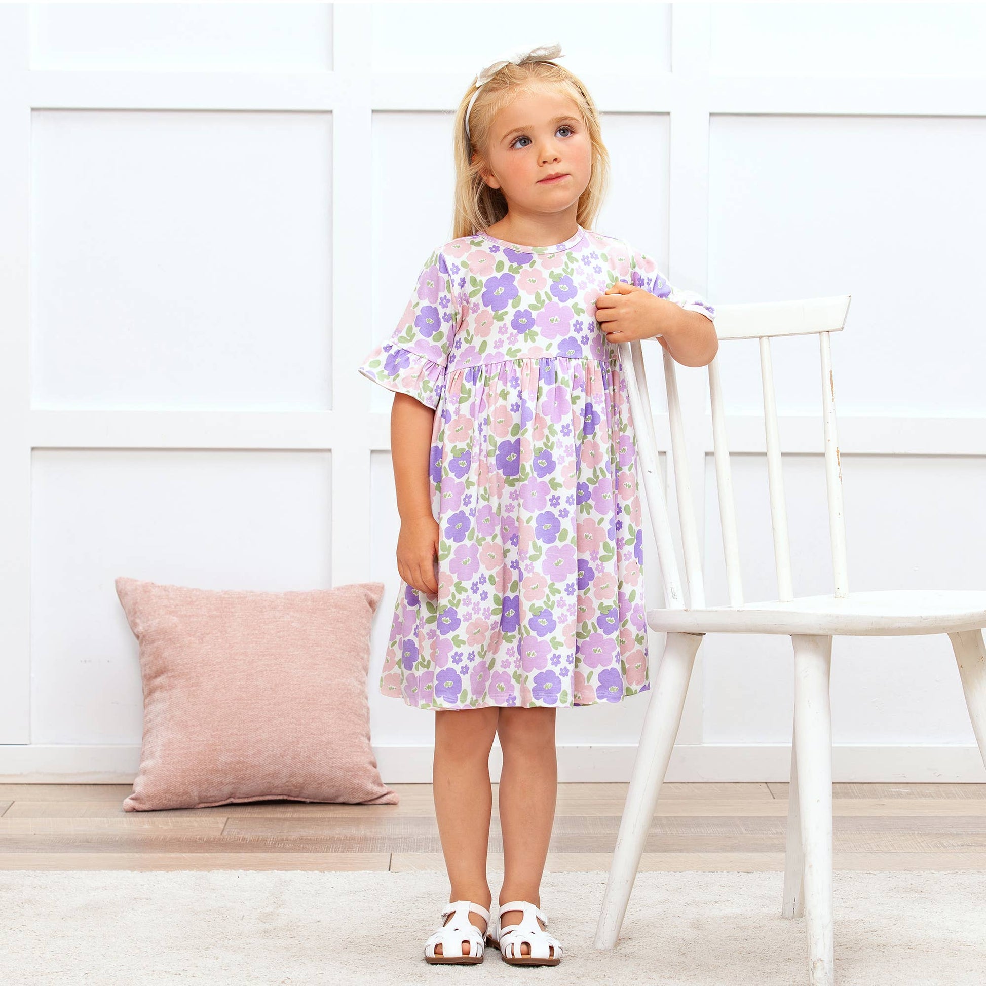 Floral Frolic Bamboo Dress, available in sizes 2T-6T, features a floral print and soft bamboo fabric.