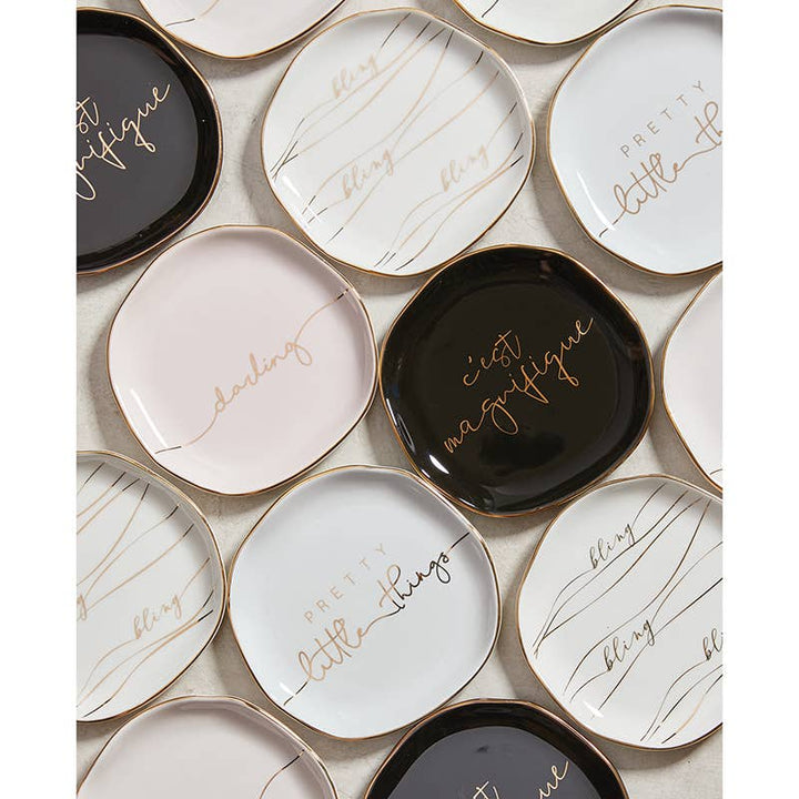 Ceramic trinket tray with gold edges, "darling" in cursive. Available in black, white, pale pink. Size options listed.