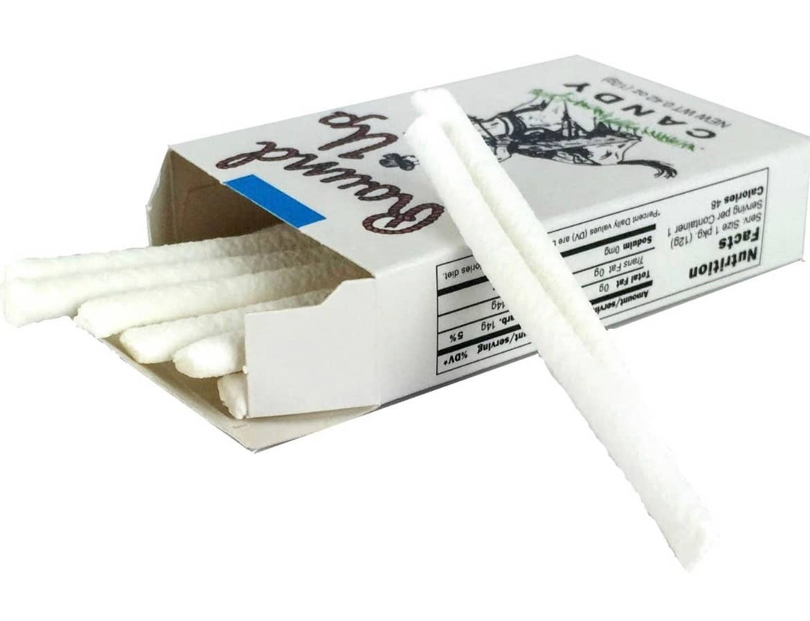 Open box of Nostalgic Old Fashioned Candy Cigarettes with white candy sticks; available in various pack sizes.