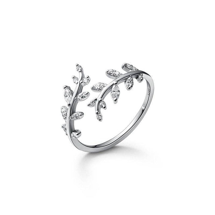 Gold and silver olive leaf branch band ring with sparkling stones in 925 sterling silver. Available sizes: 6, 7, 8.