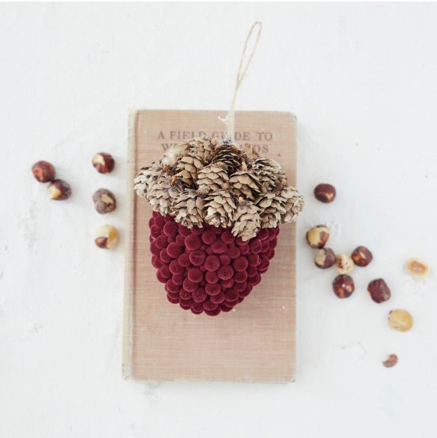 Flocked foam acorn ornament with pinecone cap, dark red velvet base, and twine loop.