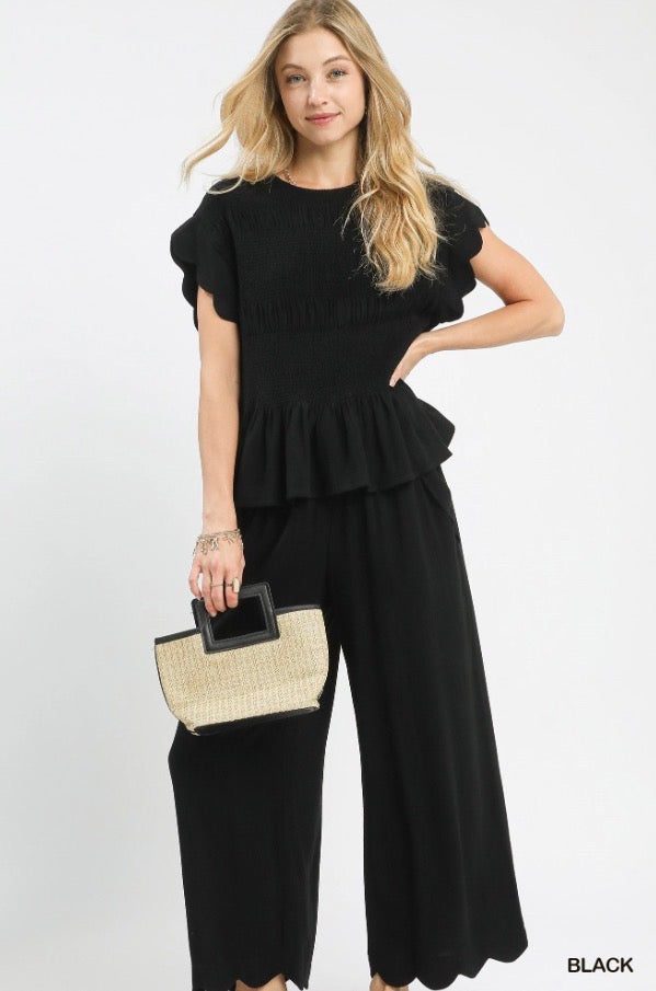 Smocked Peplum Top: black, short-sleeve, ruffle peplum hem. Available in sizes XS–XL.
