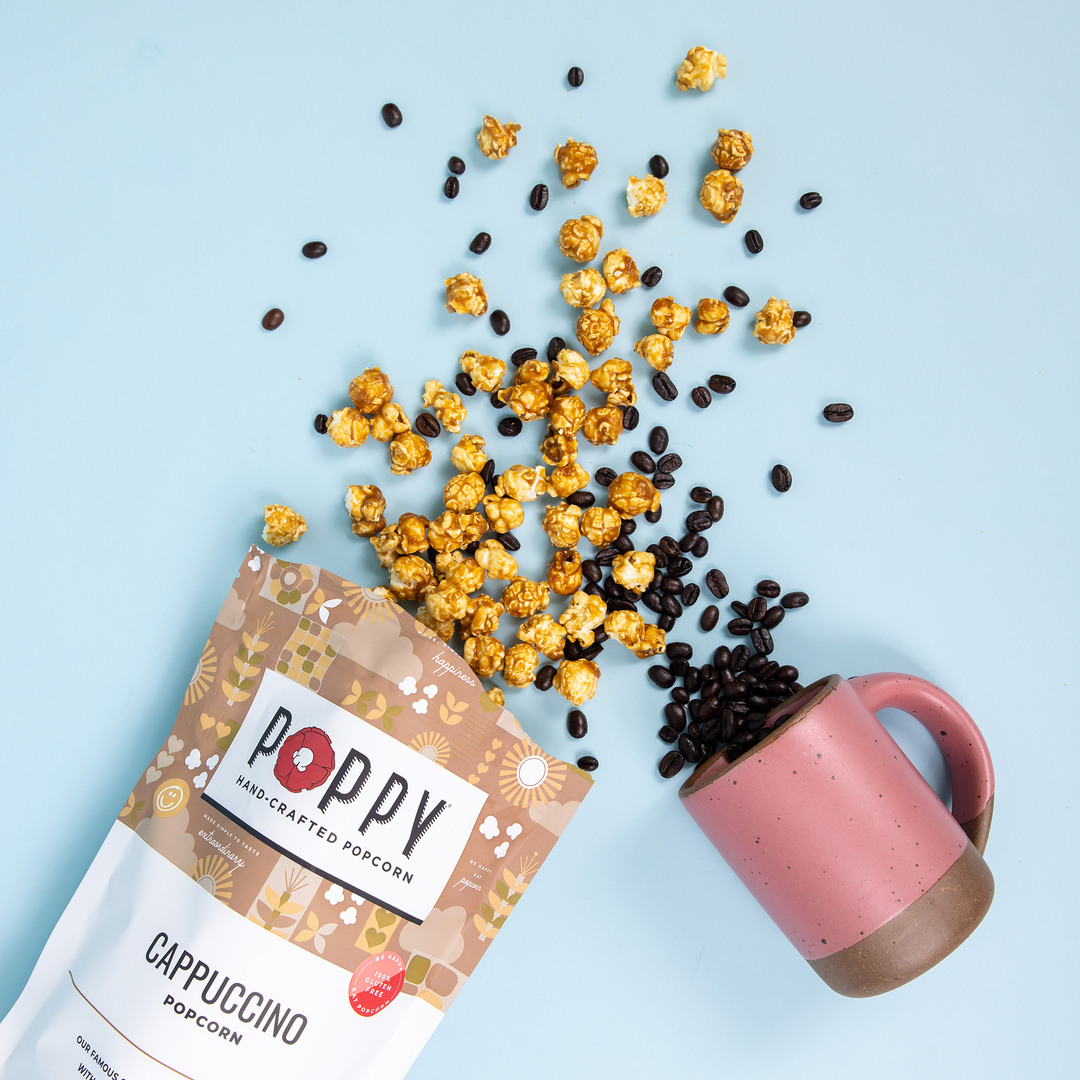 Golden Cappuccino Popcorn with coffee beans. Available in small, medium, and large sizes.