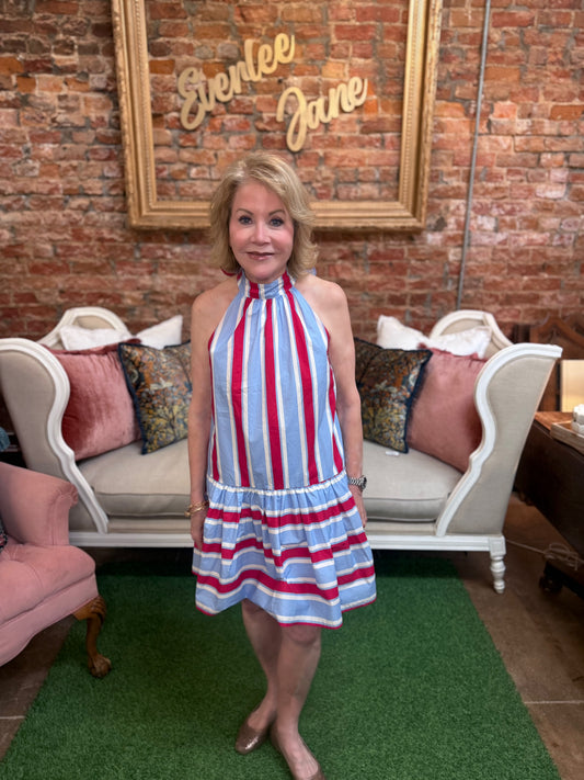 Sleeveless Liberty Lane Dress with red, white, and blue stripes. Available in sizes XS-XL.