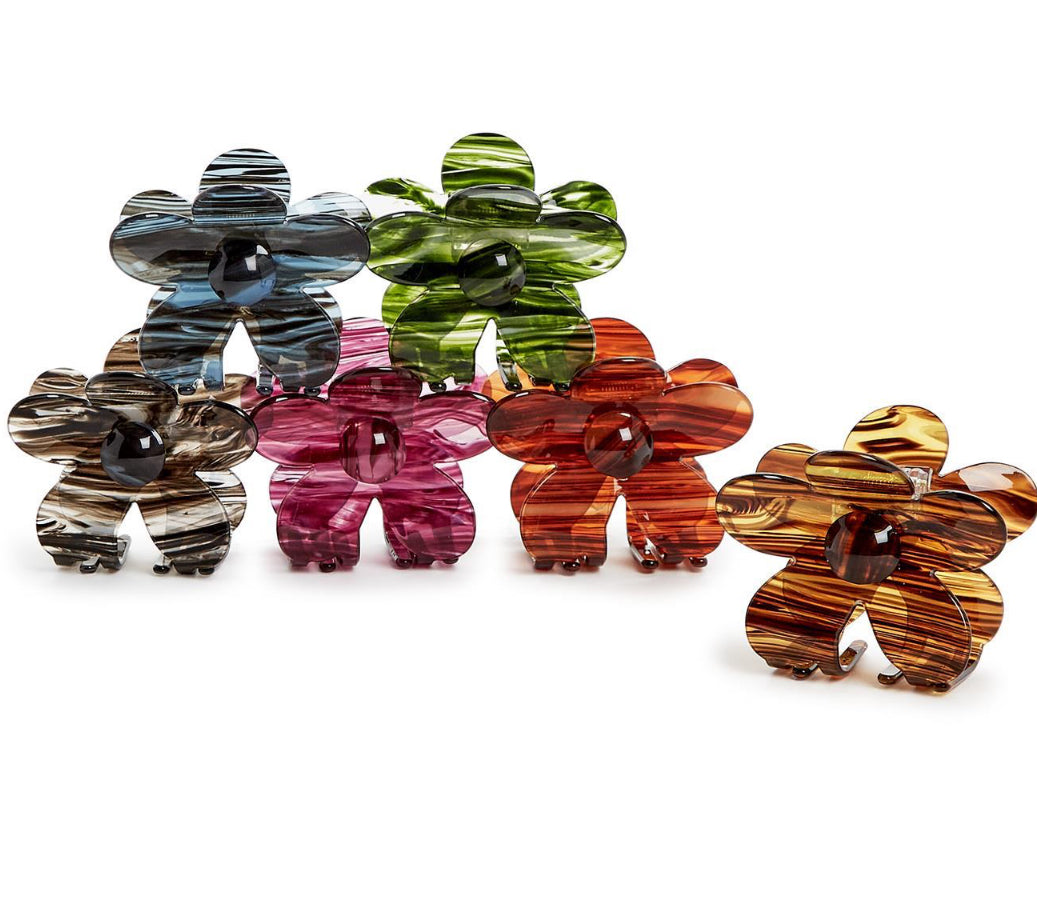 Six colorful glass flower figurines: blue, green, brown, pink, orange, and yellow. Each figurine has a striped pattern and a central round embellishment. Available sizes: Small (2 inches), Medium (3 inches), Large (4 inches).