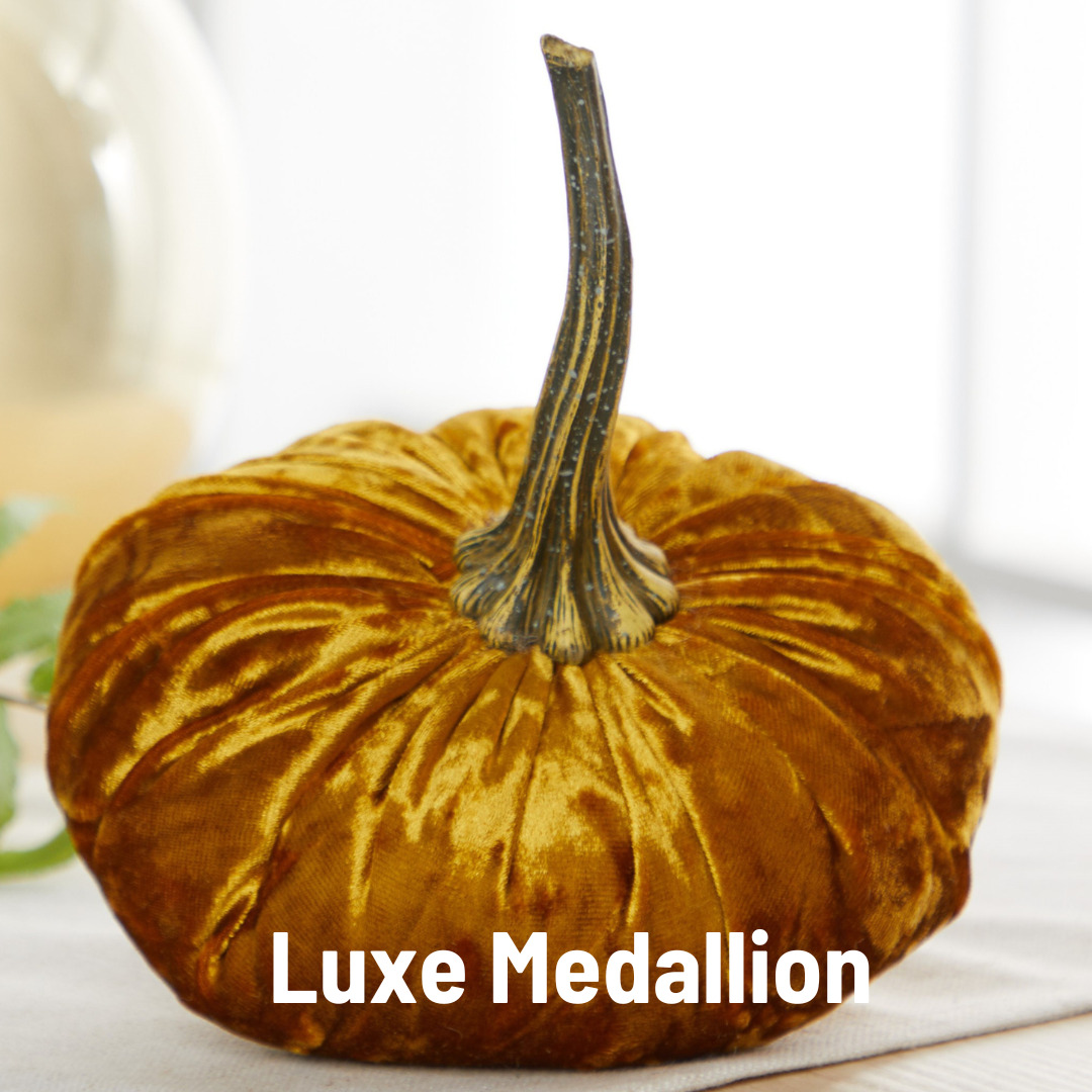 Large velvet pumpkin in ‘Fern’ shade with a realistic stem, available in multiple sizes. Text reads “Luxe Medallion.”.