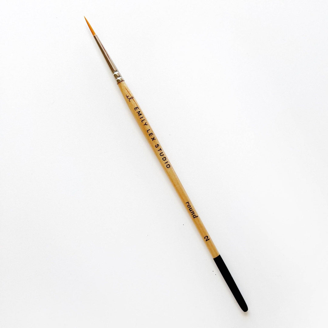 Thin watercolor paintbrush, "EMILY LEX STUDIO," Size 0, wooden handle, black tip, silver ferrule, synthetic taklon bristles.