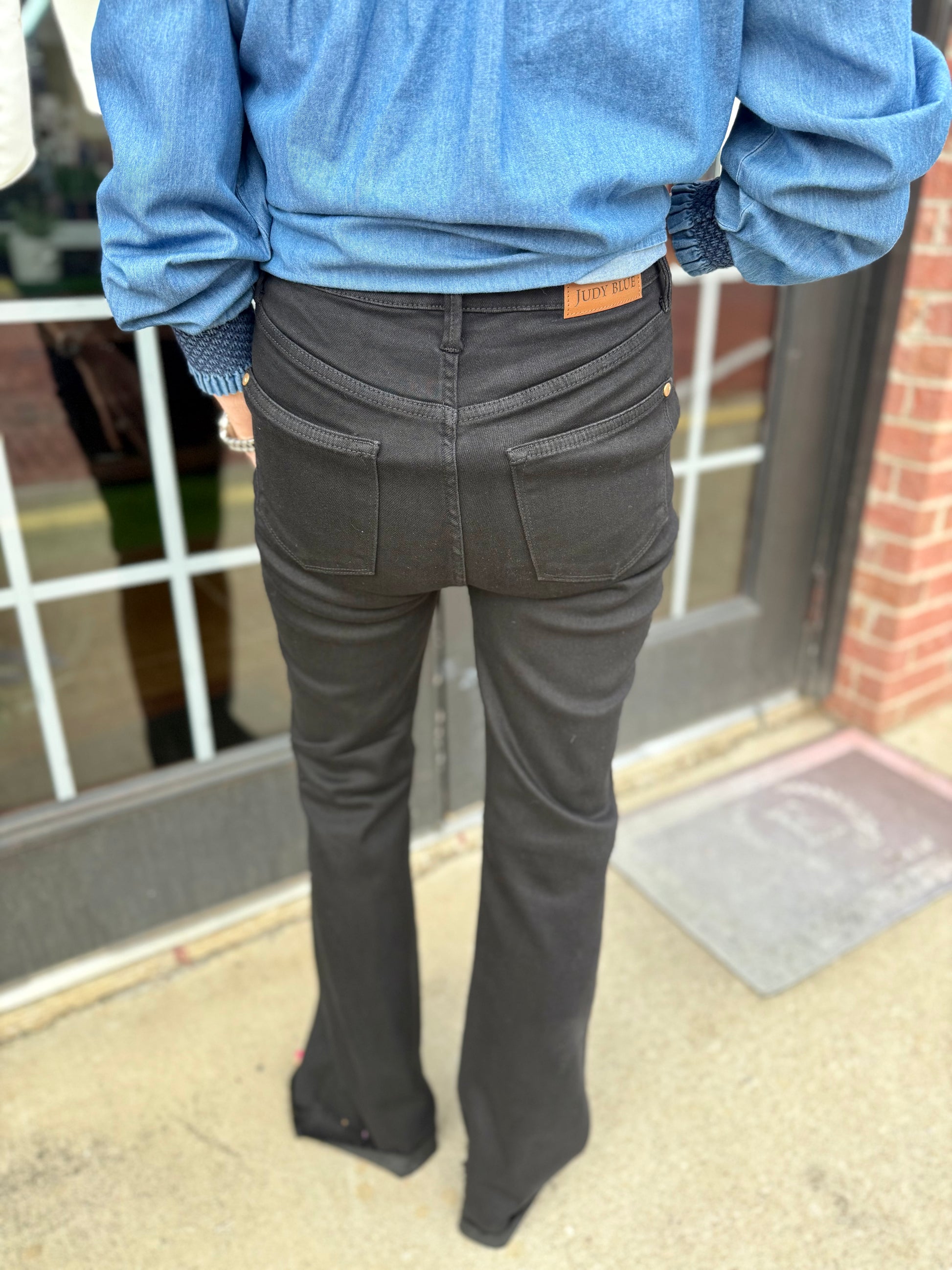 Judy Blue HW Tummy Control Cut Hem Black Flare Jeans, available in sizes 0-20W.