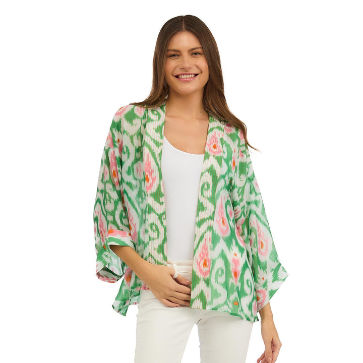 Ikat Print Green Short Kimono in green, white, and pink sustainable modal viscose. Available in sizes S, M, L.