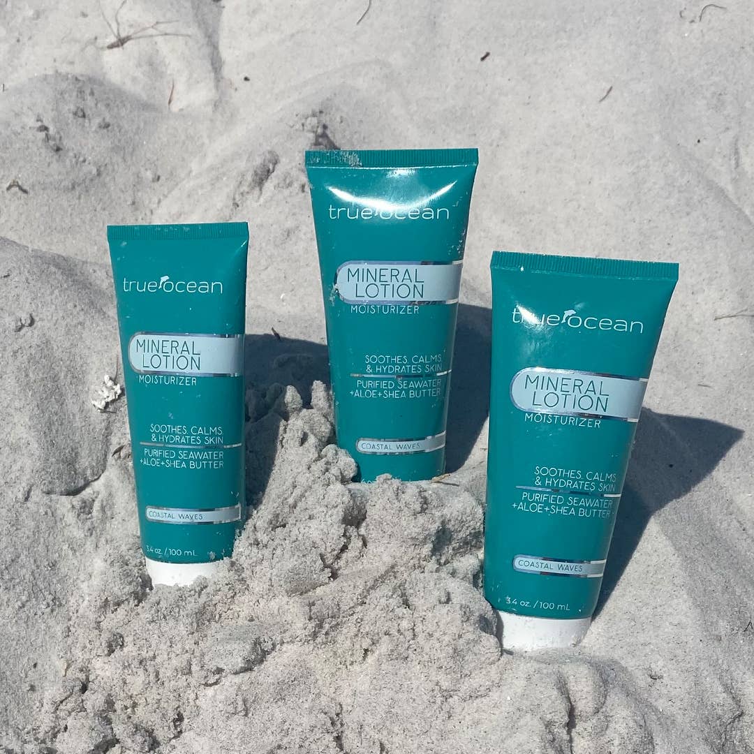 True Ocean Mineral Lotion in teal 3.4oz tubes, upright; formula enriched with ocean minerals.