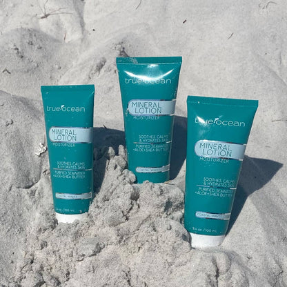 True Ocean Mineral Lotion in teal 3.4oz tubes, upright; formula enriched with ocean minerals.