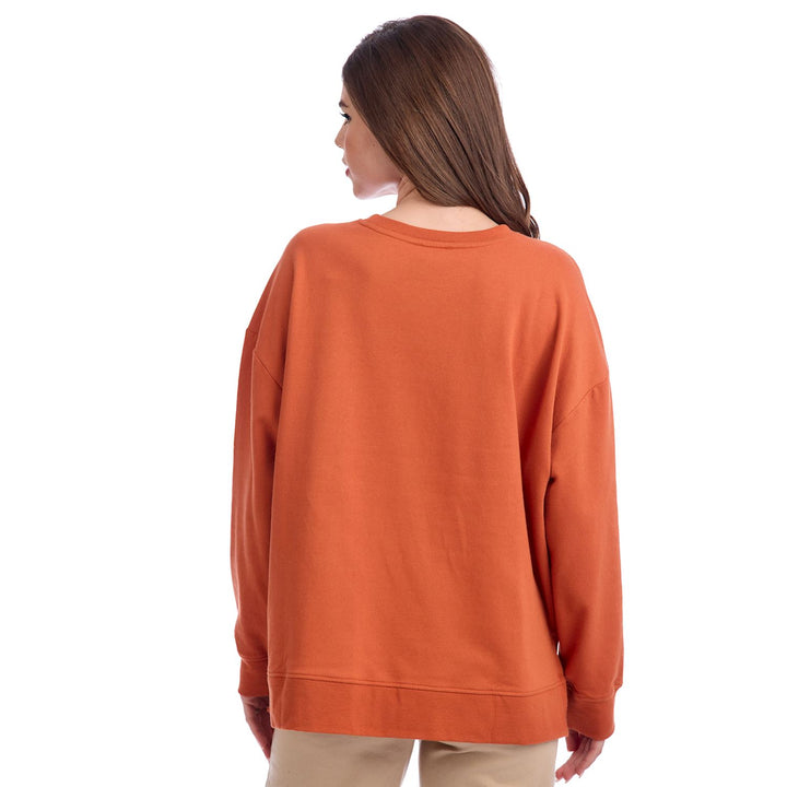 Oversized Pumpkin Spice Sweatshirt; available in sizes S–XL.