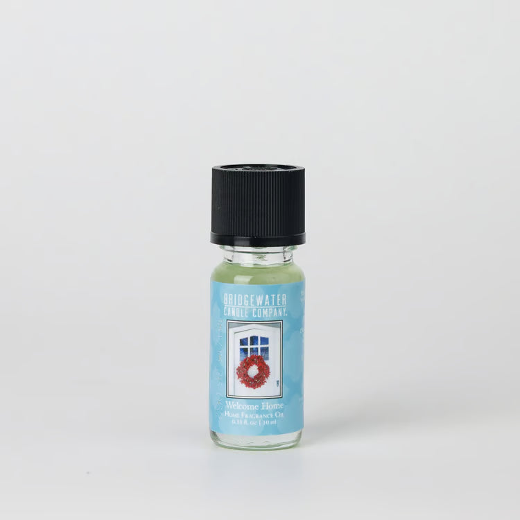 Welcome Home Fragrance Oil, 0.33 fluid ounce glass bottle with black cap and door-and-wreath label.