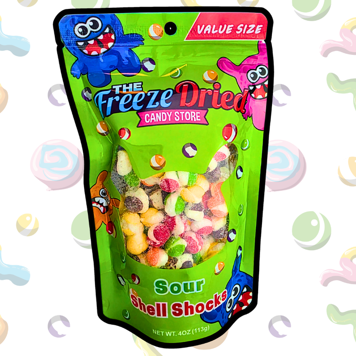 Green bag labeled "Freeze Dried Shell Shocks: Sour Wild Berry," 4 oz (113g), value size, cartoon monsters on packaging.